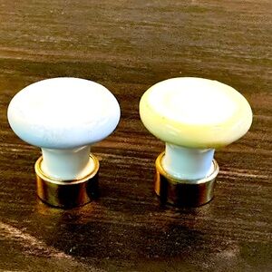 Set of two French vintage porcelain knobs with solid brass base